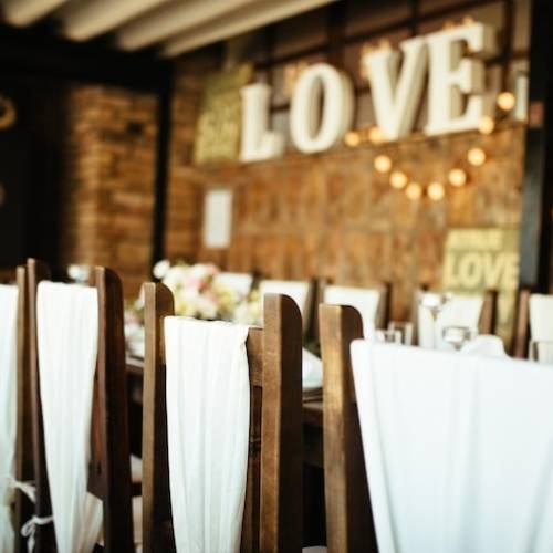 decorated-chairs-indoor-wedding