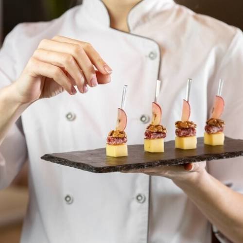 front-view-chef-holding-delcious