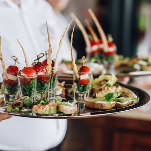 waiter-keeps-salver-with-snacks (1)